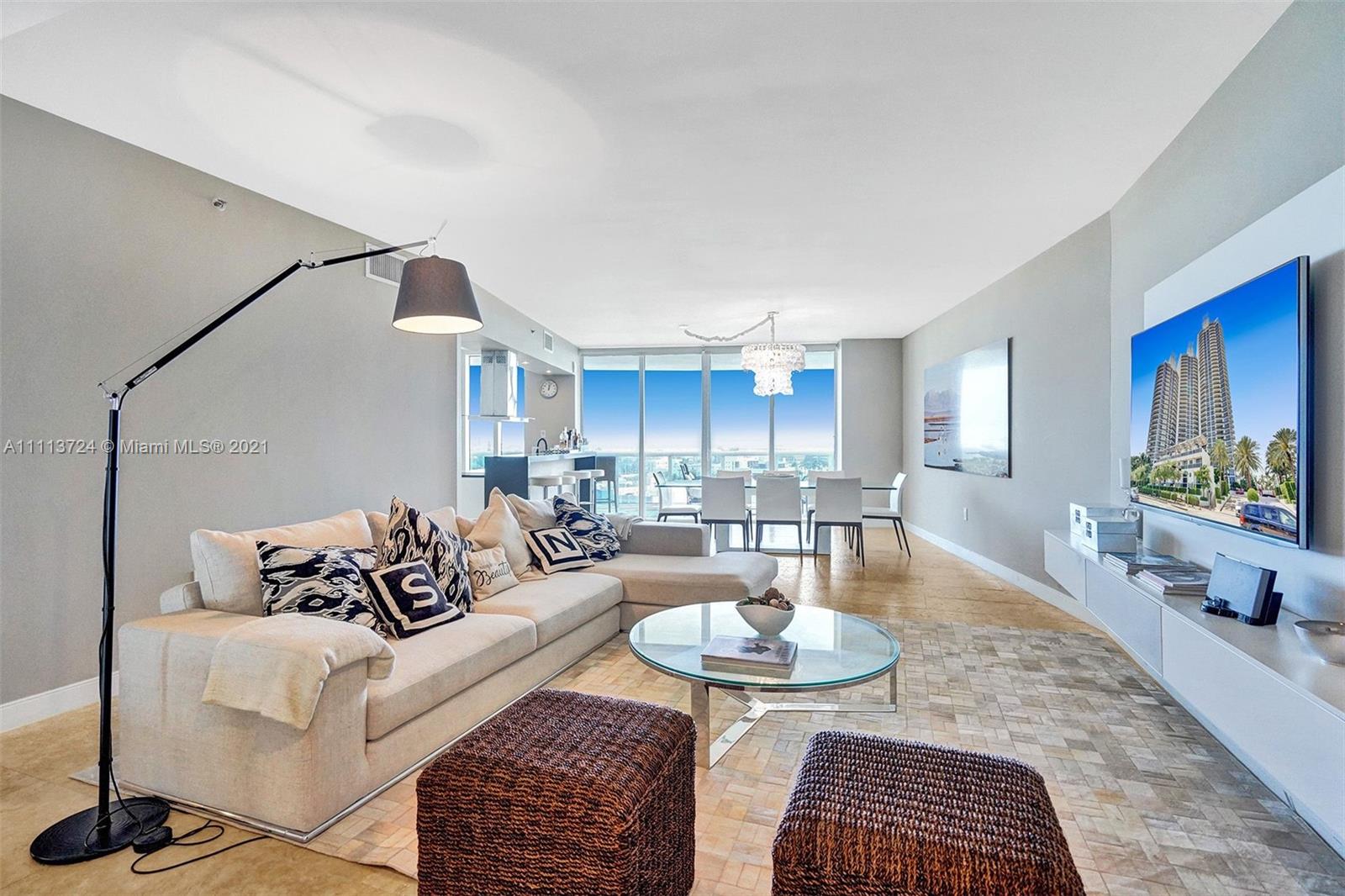 400 Alton Road, Unit 1011 Miami Beach, FL 33139 - Photo 7 of 27 a living room with furniture potted plant and a table