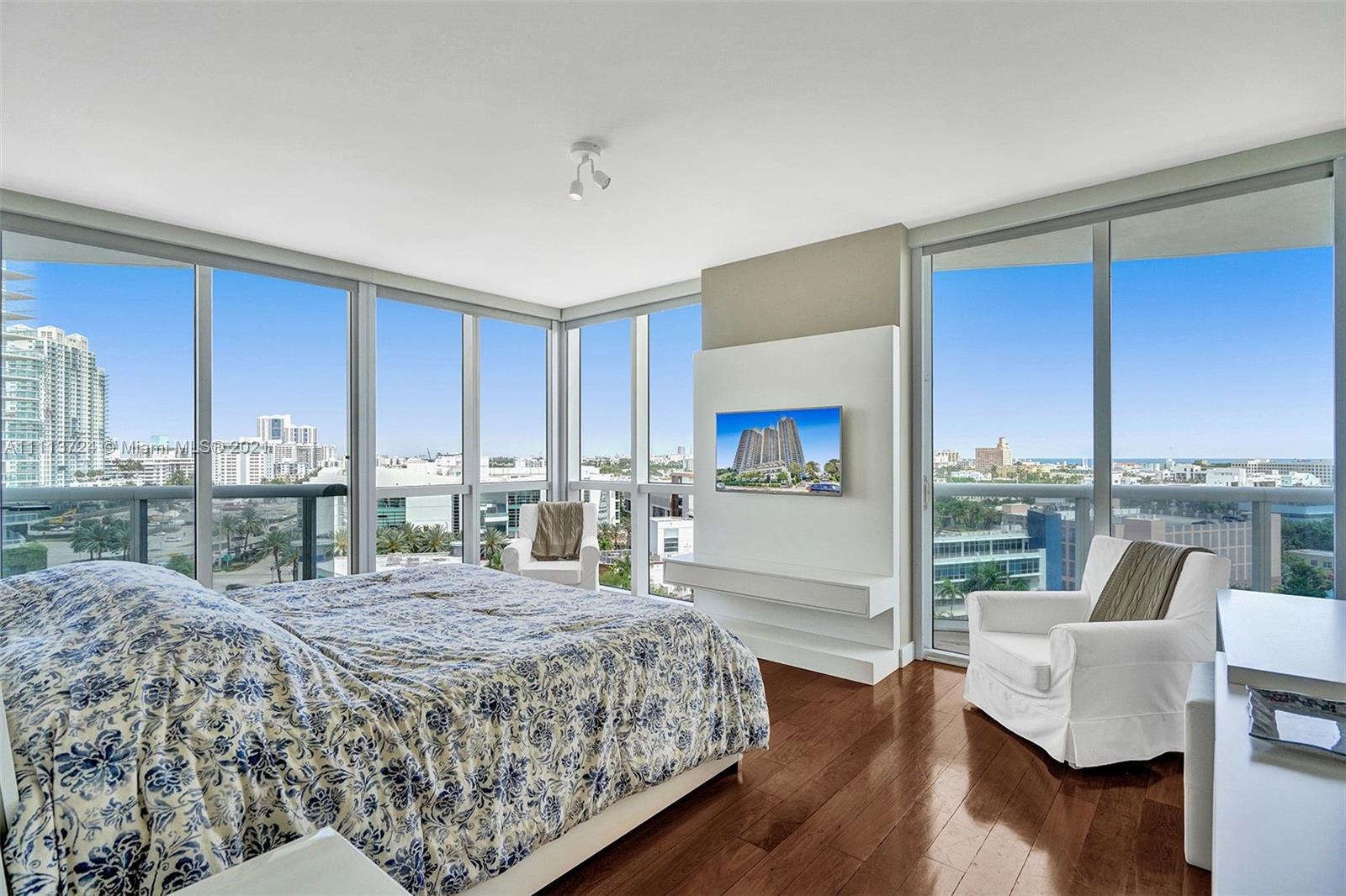 400 Alton Road, Unit 1011 Miami Beach, FL 33139 - Photo 9 of 27 a bed room with a bed and a couch