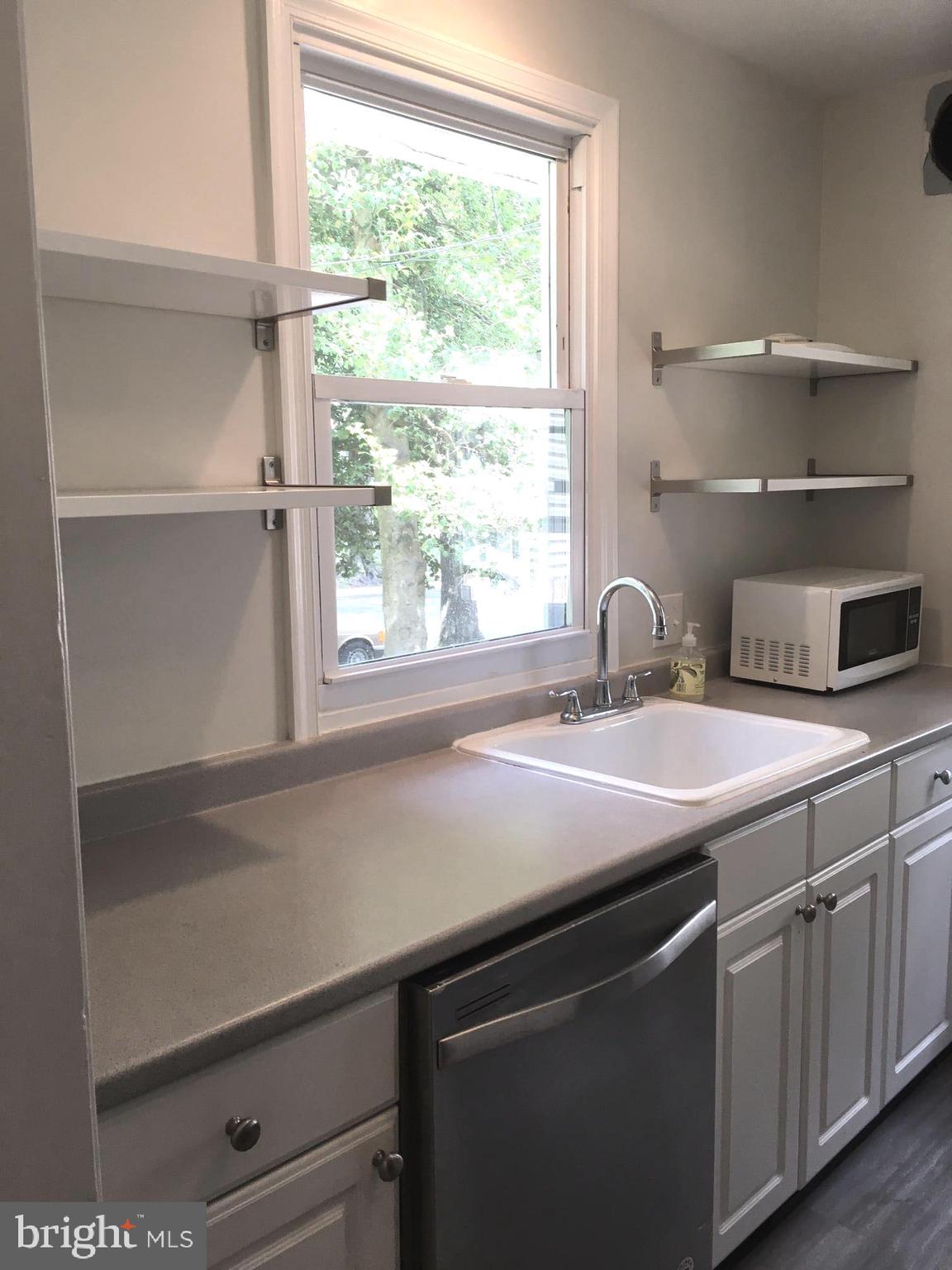 6410 Stoneham Road Bethesda, MD 20817 - Photo 12 of 20 a kitchen with a sink and a window
