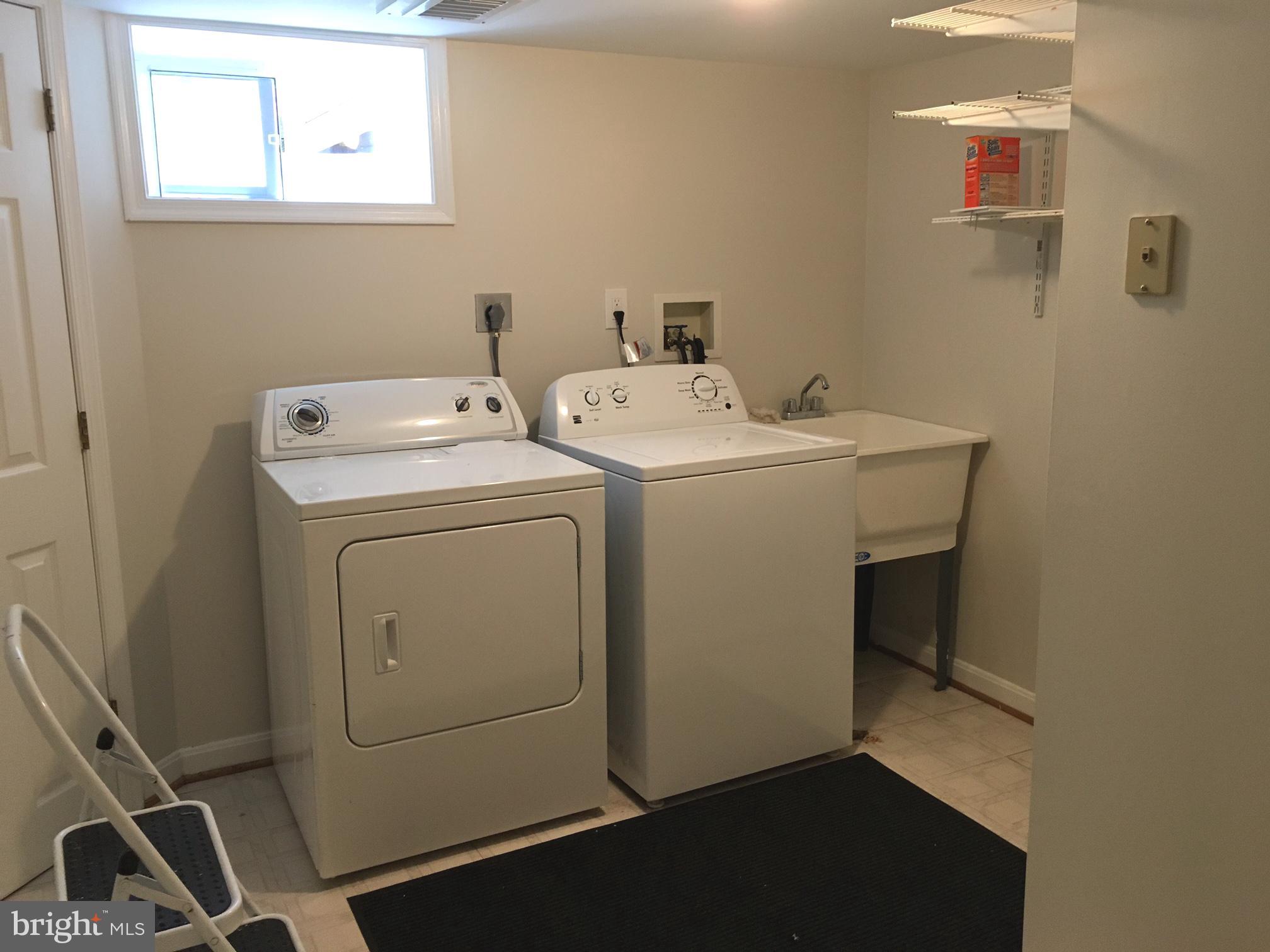 6410 Stoneham Road Bethesda, MD 20817 - Photo 18 of 20 a utility room with dryer and washer