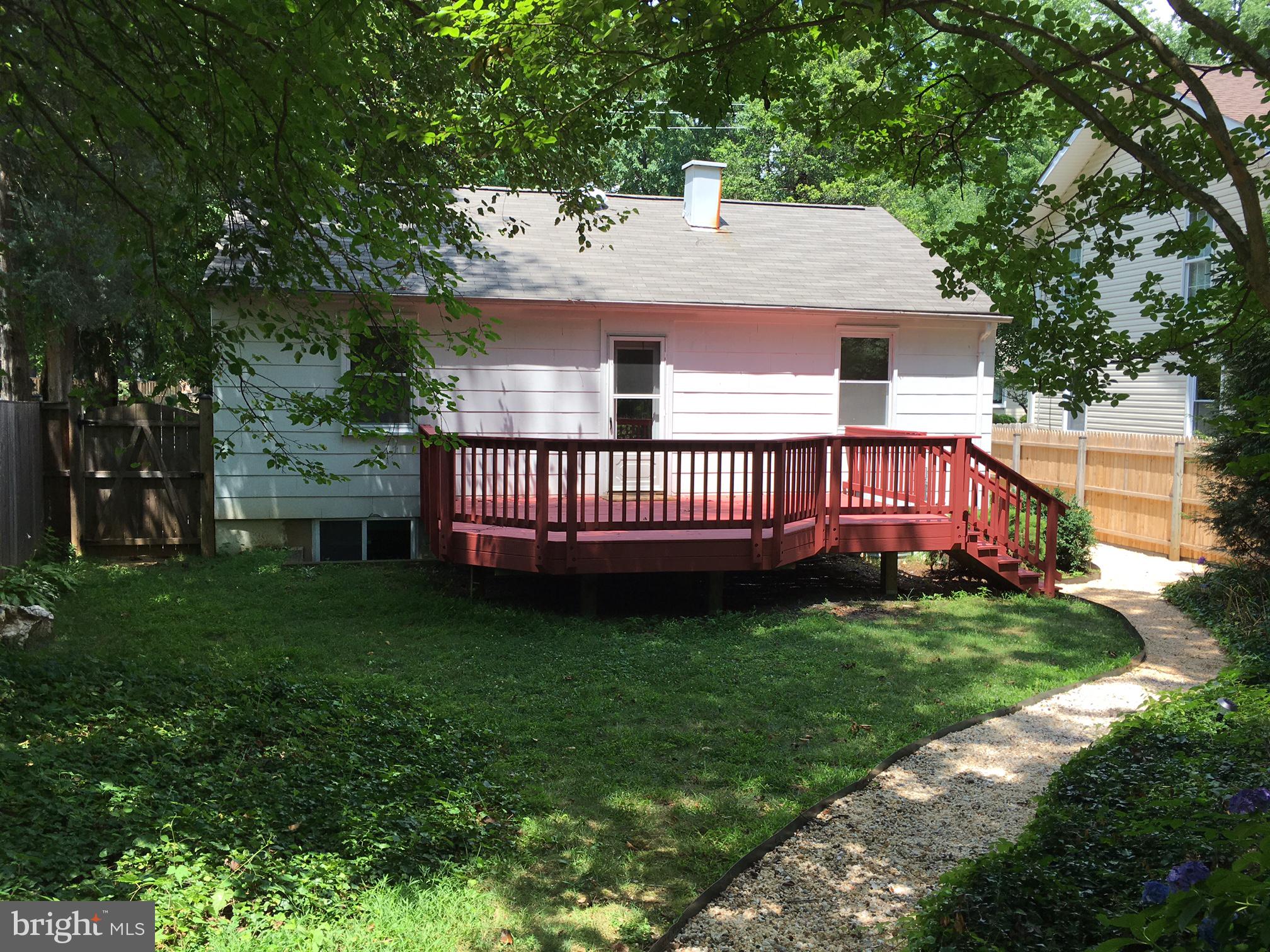 6410 Stoneham Road Bethesda, MD 20817 - Photo 20 of 20 a view of a house with backyard and garden