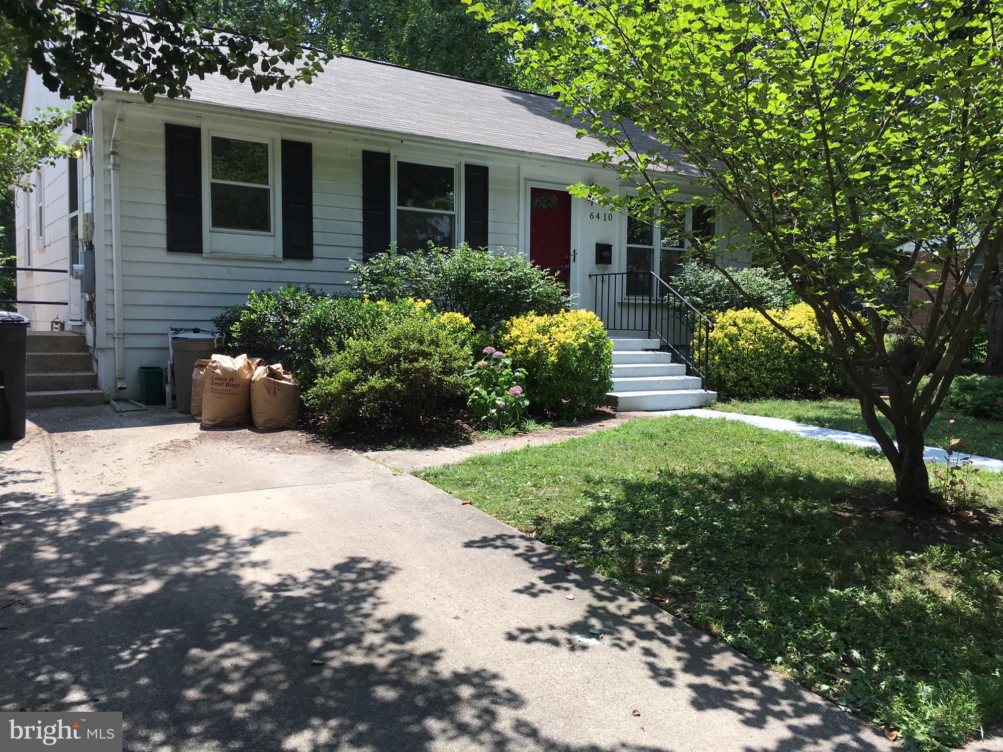 6410 Stoneham Road Bethesda, MD 20817 - Photo 5 of 20 a front view of a house with garden