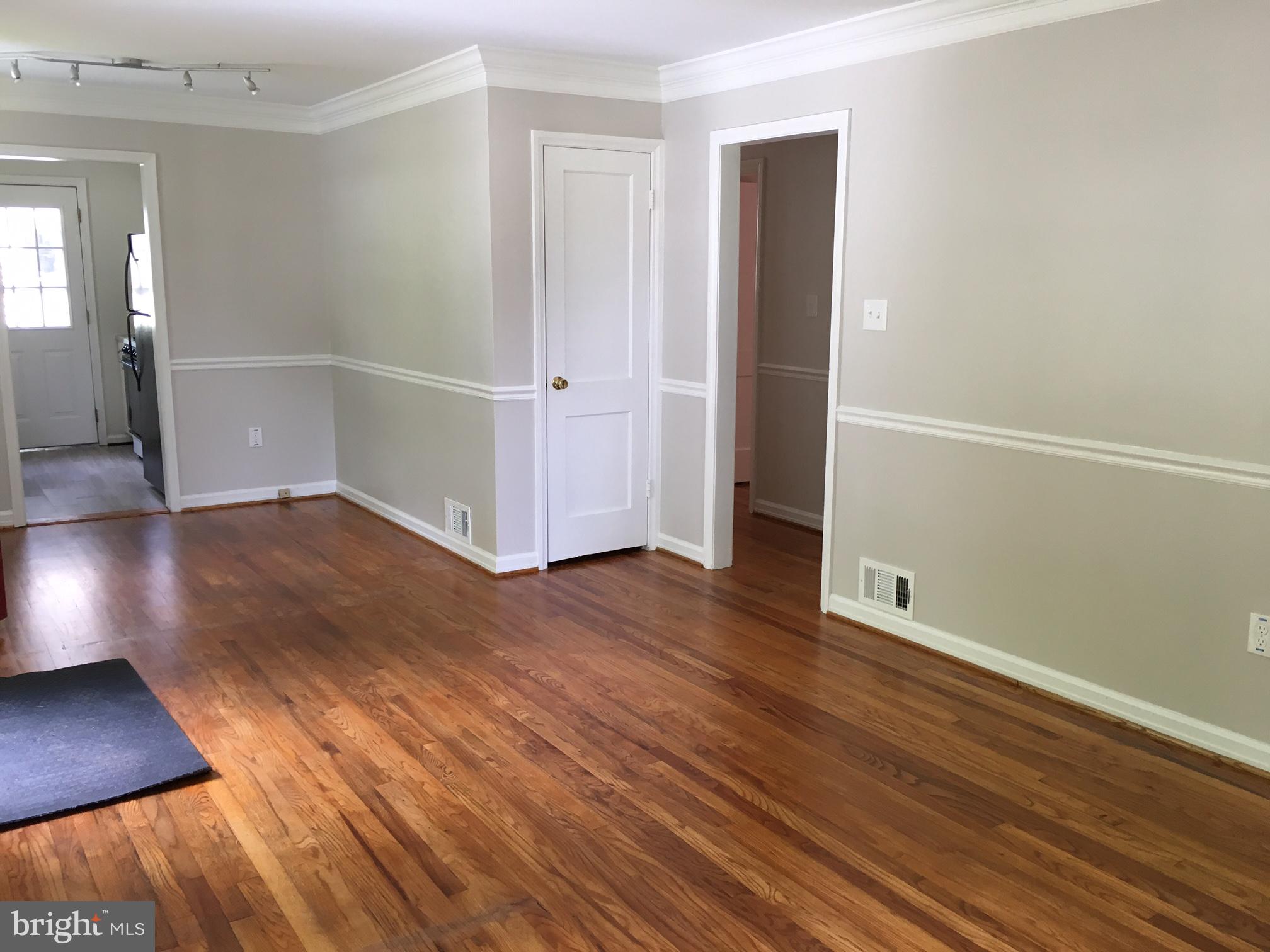 6410 Stoneham Road Bethesda, MD 20817 - Photo 8 of 20 an empty room with wooden floor & closet area