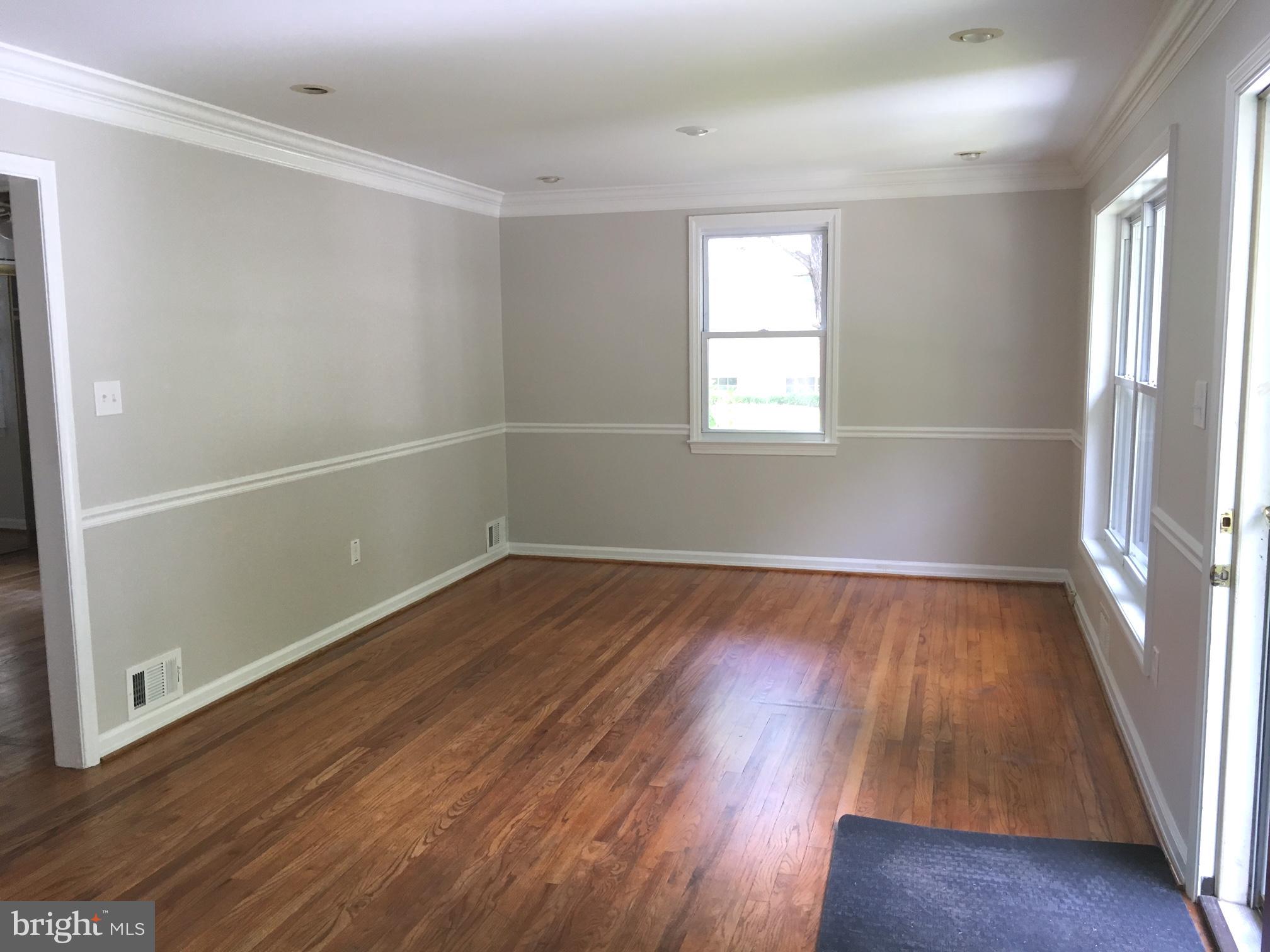 6410 Stoneham Road Bethesda, MD 20817 - Photo 9 of 20 wooden floor in an empty room with a window
