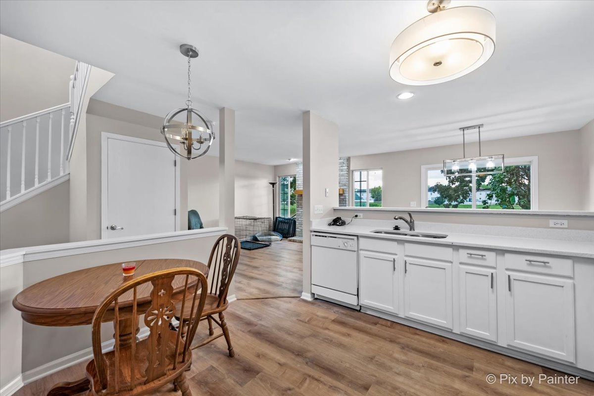 10769 Cape Cod Lane Huntley, IL 60142 - Photo 12 of 25 a large kitchen with a table and chairs