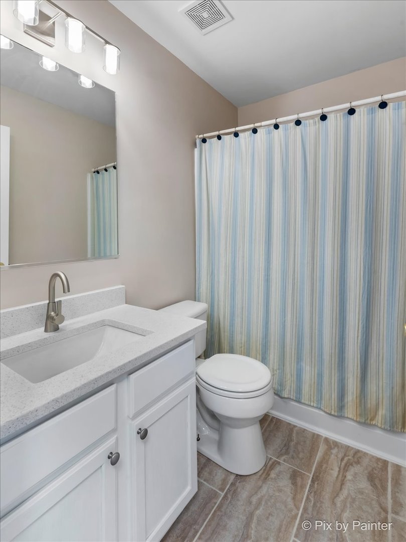 10769 Cape Cod Lane Huntley, IL 60142 - Photo 13 of 25 a bathroom with a sink a toilet and shower