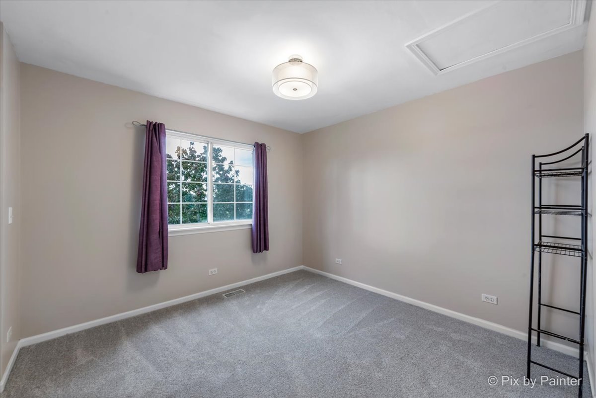 10769 Cape Cod Lane Huntley, IL 60142 - Photo 17 of 25 a view of an empty room with a window