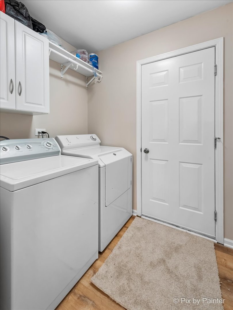 10769 Cape Cod Lane Huntley, IL 60142 - Photo 19 of 25 a utility room with dryer and washer