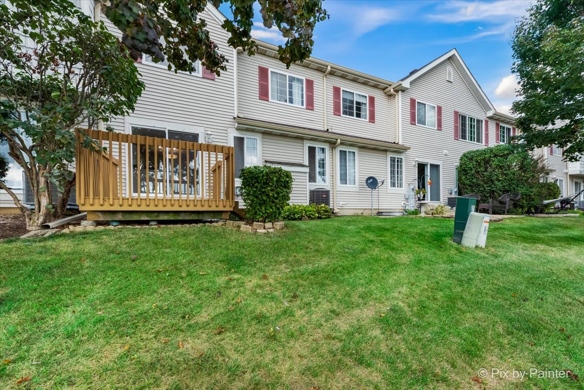 10769 Cape Cod Lane Huntley, IL 60142 - Photo 20 of 25 a front view of a house with a yard