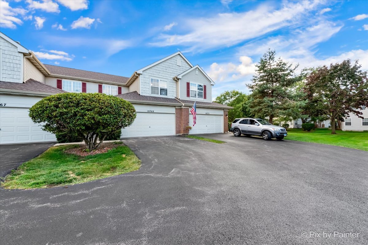 10769 Cape Cod Lane Huntley, IL 60142 - Photo 23 of 25 a house view with a outdoor space