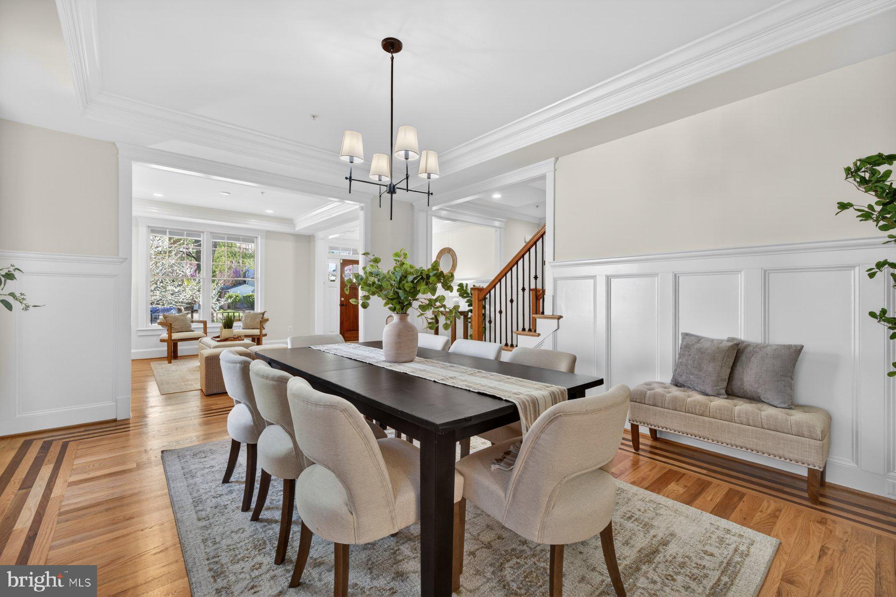 5011 Rugby Avenue Bethesda, MD 20814 - Photo 11 of 65 a view of a dining room with furniture and a chandelier