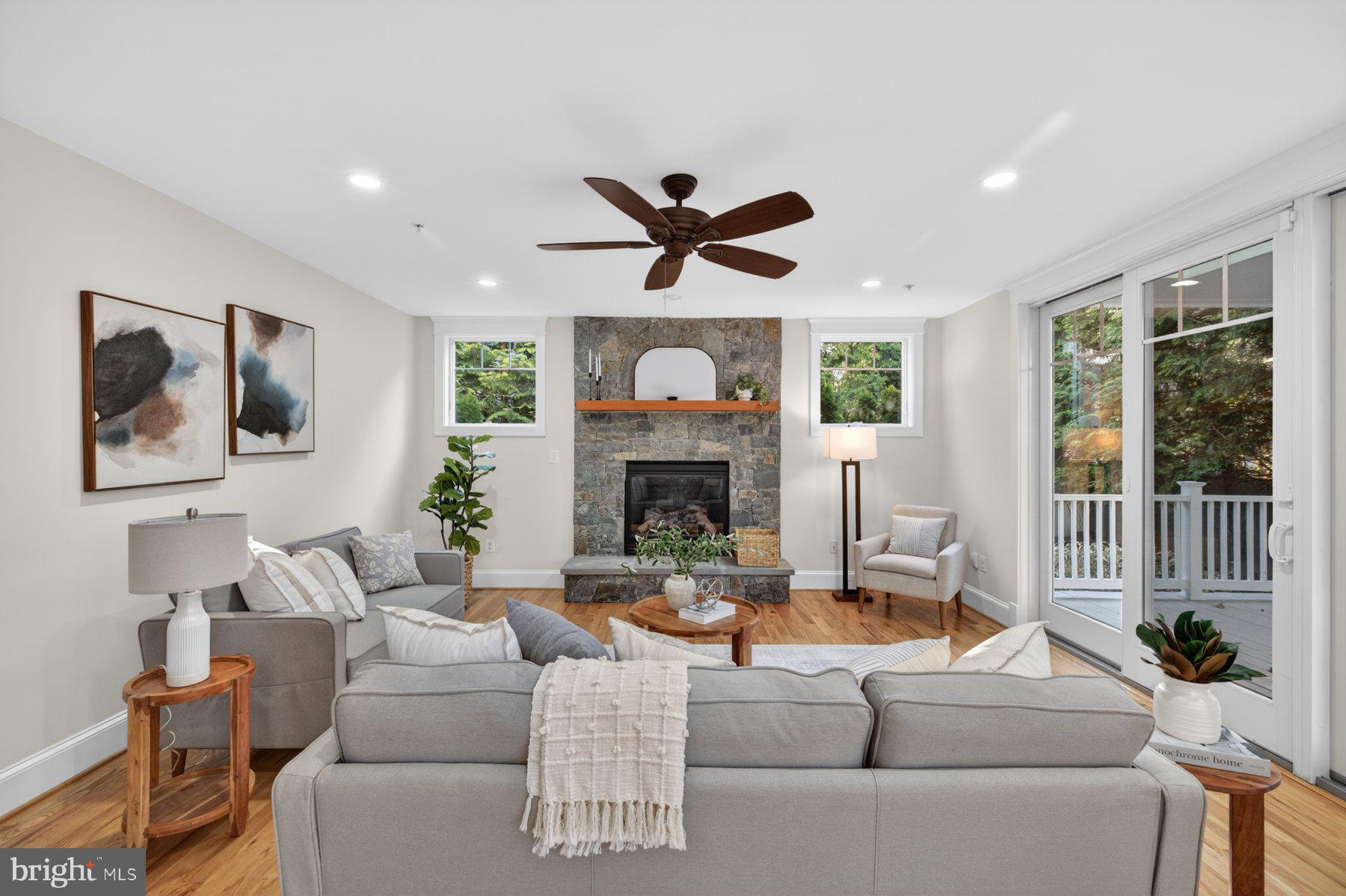 5011 Rugby Avenue Bethesda, MD 20814 - Photo 18 of 65 a living room with furniture a fireplace and a large window
