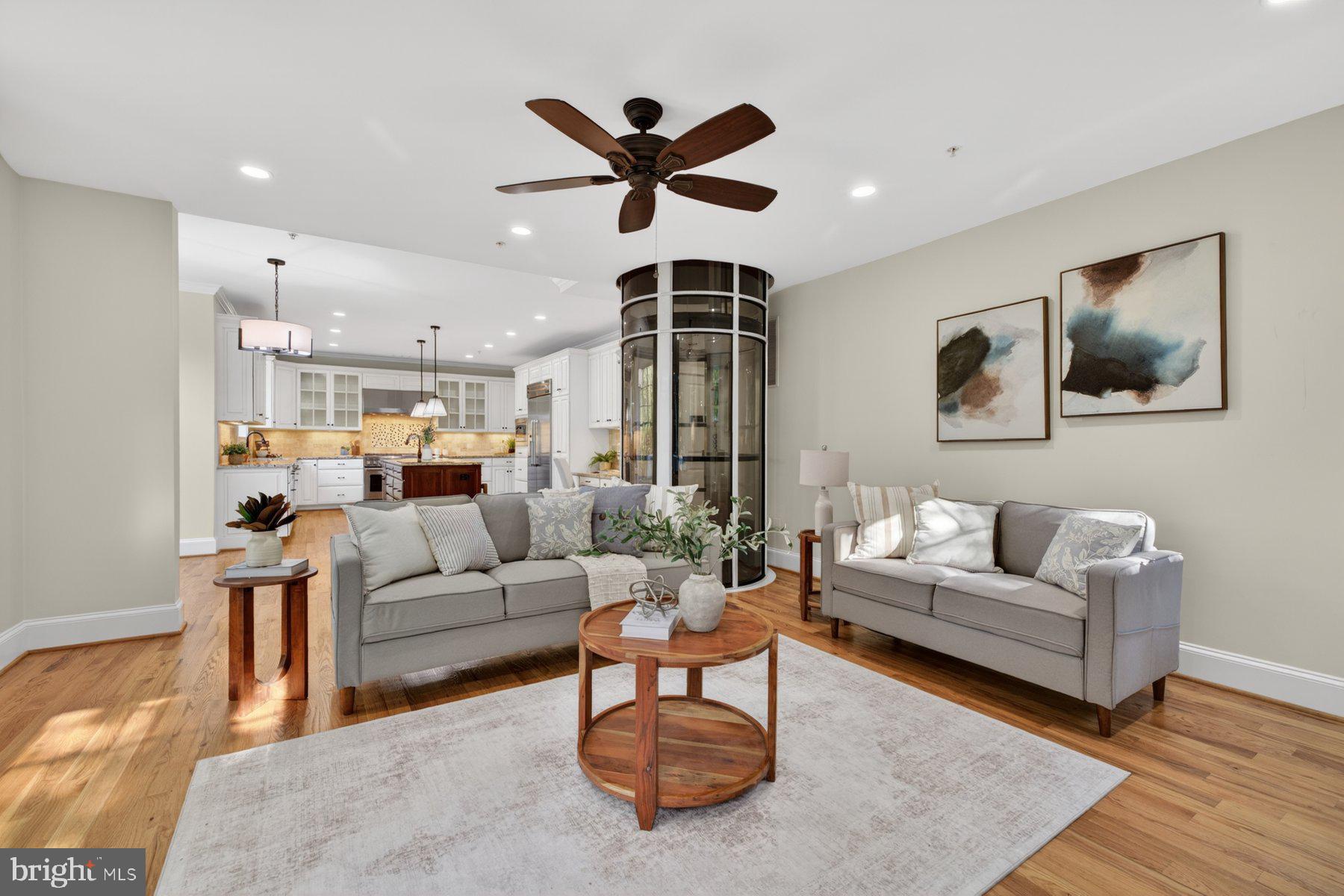 5011 Rugby Avenue Bethesda, MD 20814 - Photo 21 of 65 a living room with furniture ceiling fan and a rug