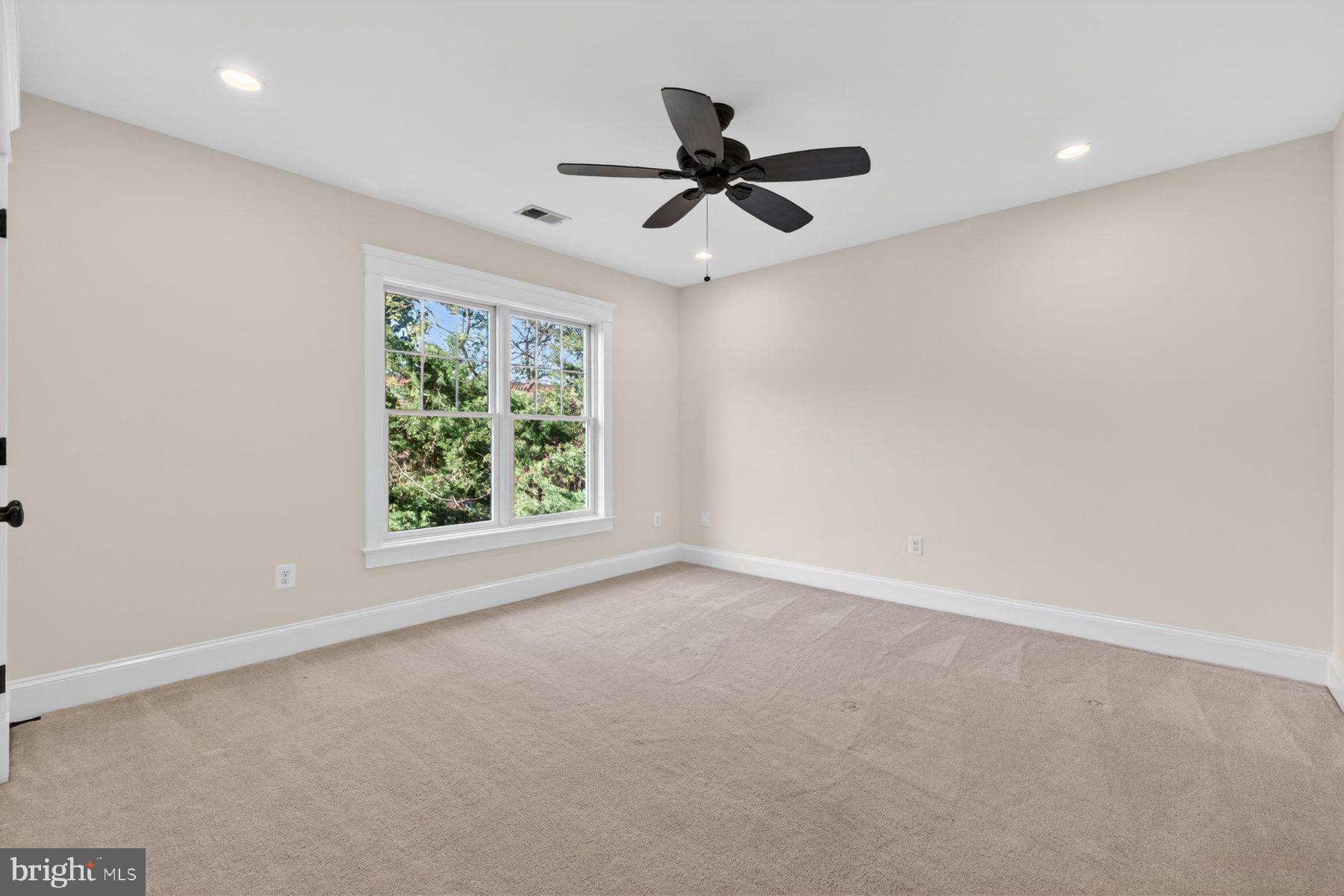 5011 Rugby Avenue Bethesda, MD 20814 - Photo 25 of 65 an empty room with a window