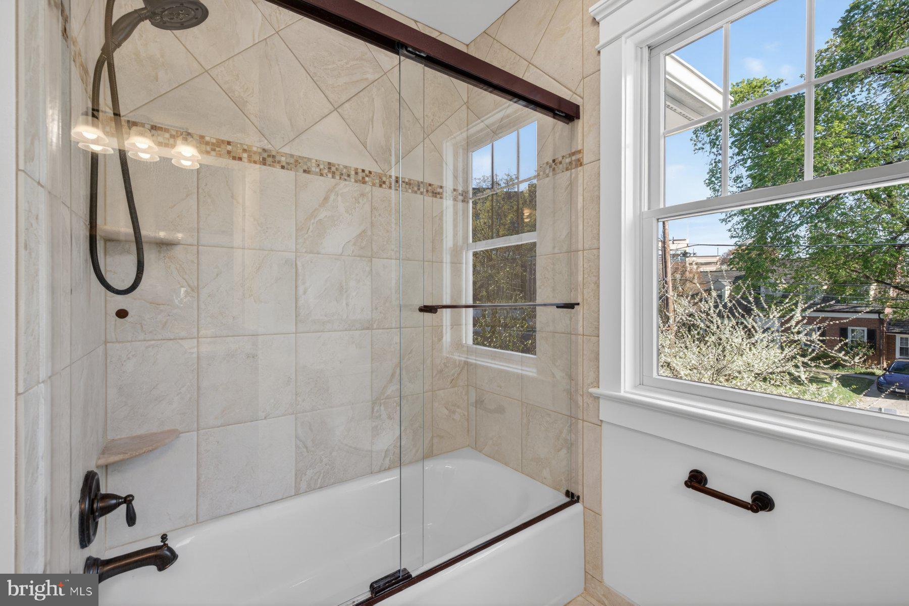 5011 Rugby Avenue Bethesda, MD 20814 - Photo 31 of 65 a bathroom with a shower