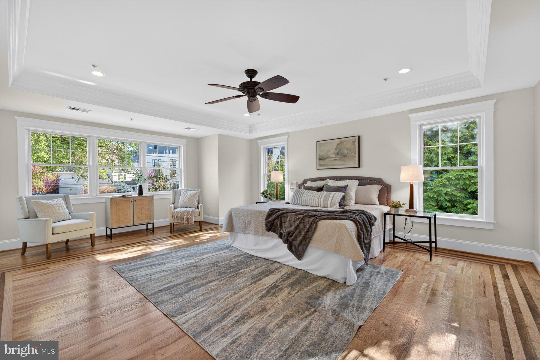 5011 Rugby Avenue Bethesda, MD 20814 - Photo 33 of 65 a bedroom with a bed wooden floor and large window