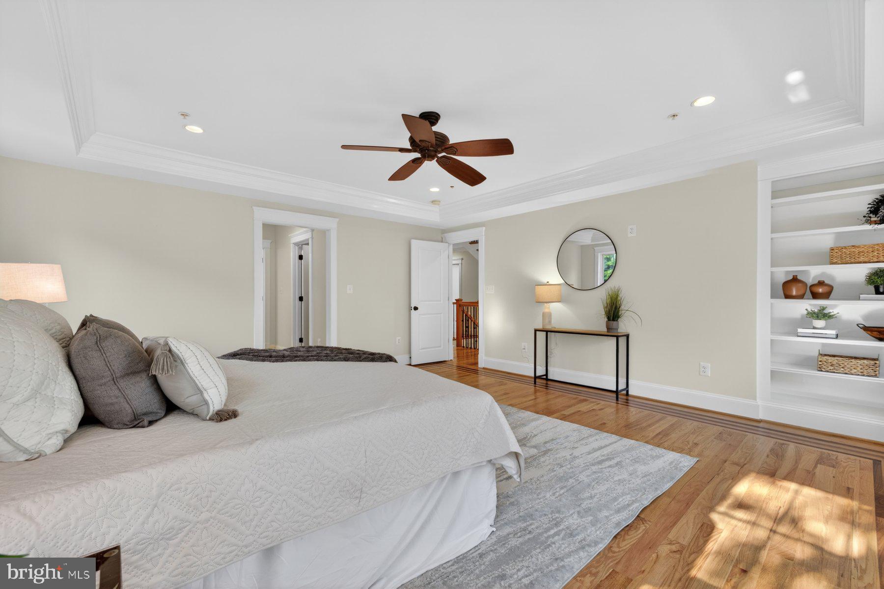 5011 Rugby Avenue Bethesda, MD 20814 - Photo 35 of 65 a bedroom with a bed and a chandelier