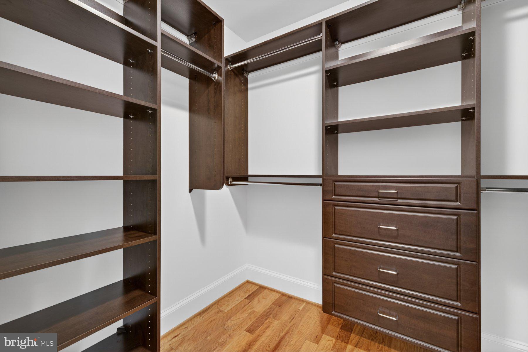 5011 Rugby Avenue Bethesda, MD 20814 - Photo 36 of 65 a view of walk in closet with empty racks