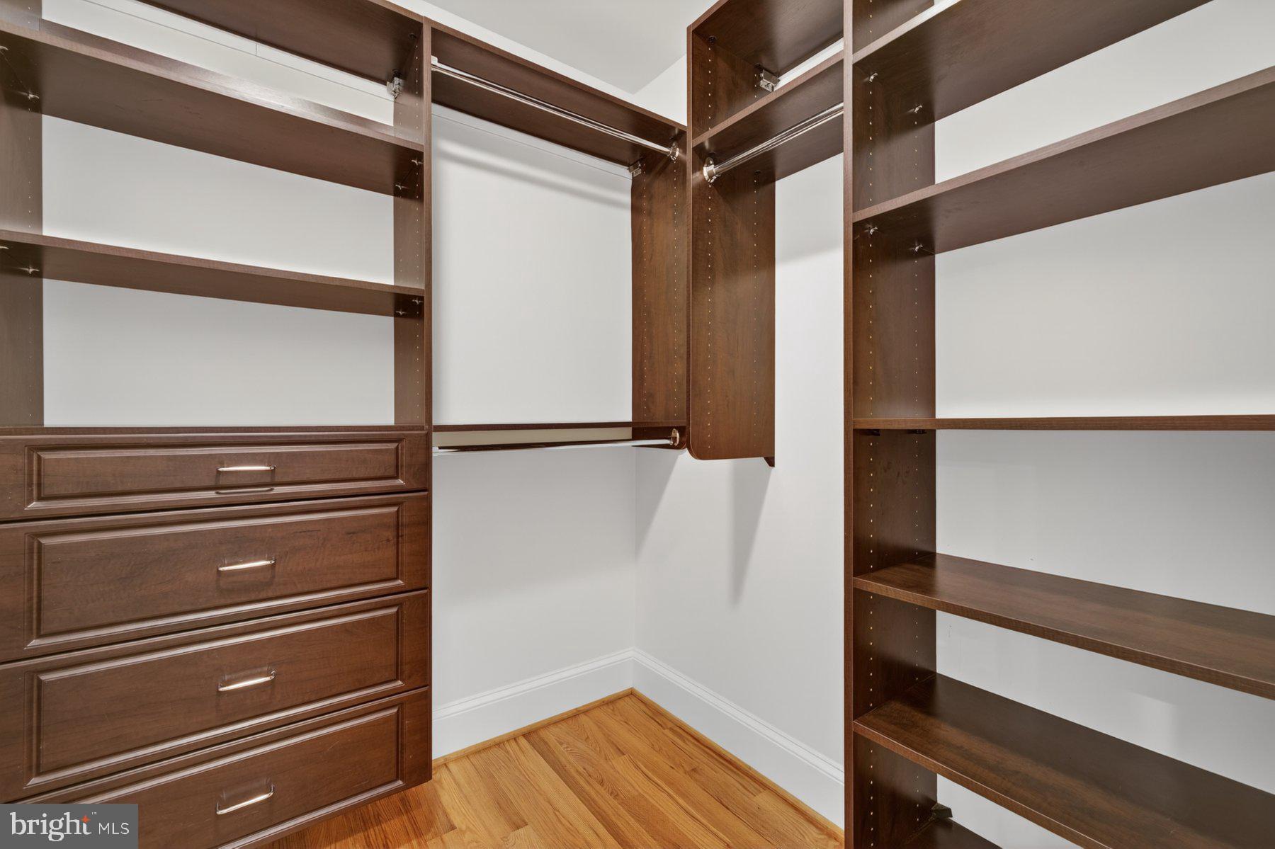 5011 Rugby Avenue Bethesda, MD 20814 - Photo 37 of 65 a view of walk in closet with empty racks