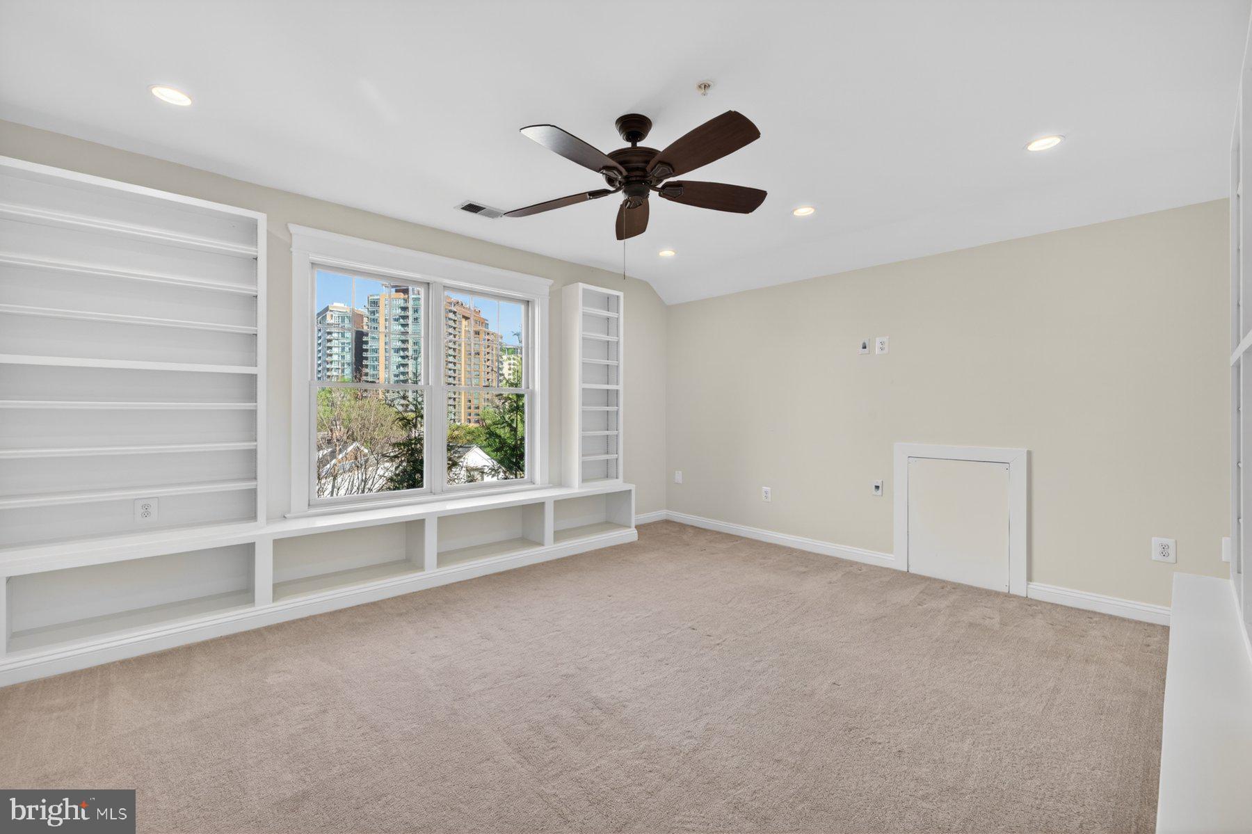 5011 Rugby Avenue Bethesda, MD 20814 - Photo 44 of 65 a view of an empty room with a window