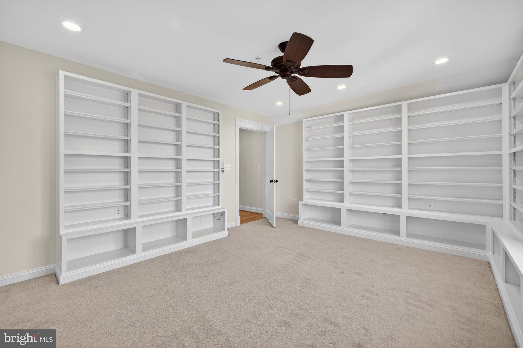 5011 Rugby Avenue Bethesda, MD 20814 - Photo 45 of 65 a view of an empty room with a ceiling fan