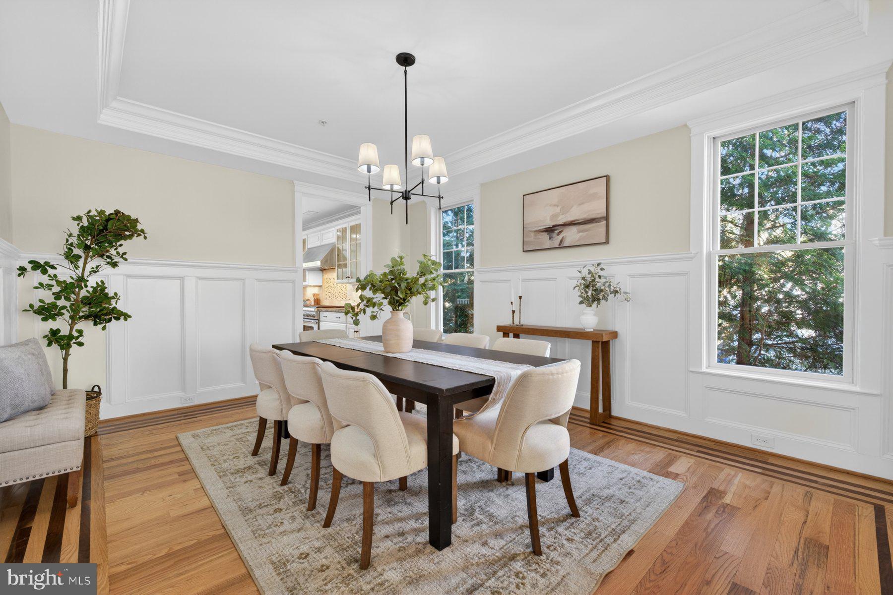 5011 Rugby Avenue Bethesda, MD 20814 - Photo 9 of 65 a view of a dining room with furniture window and wooden floor
