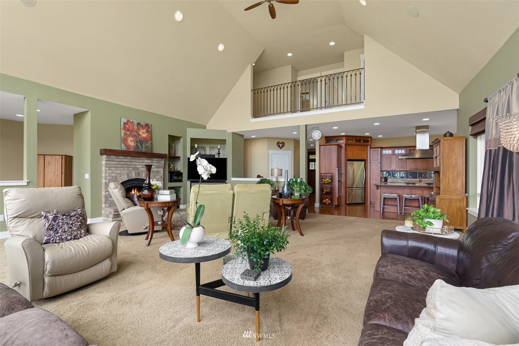 10434 Tilley Road Southwest Olympia, WA 98501 - Photo 11 of 40 a living room with furniture kitchen view and a fireplace