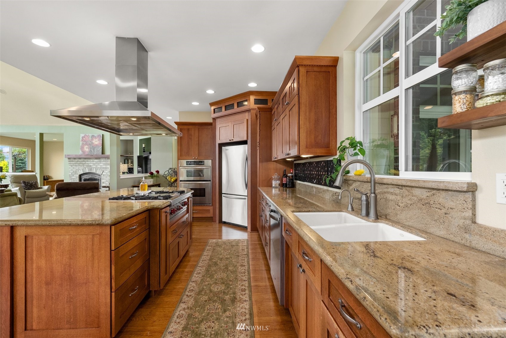 10434 Tilley Road Southwest Olympia, WA 98501 - Photo 16 of 40 a kitchen with stainless steel appliances granite countertop sink stove and refrigerator