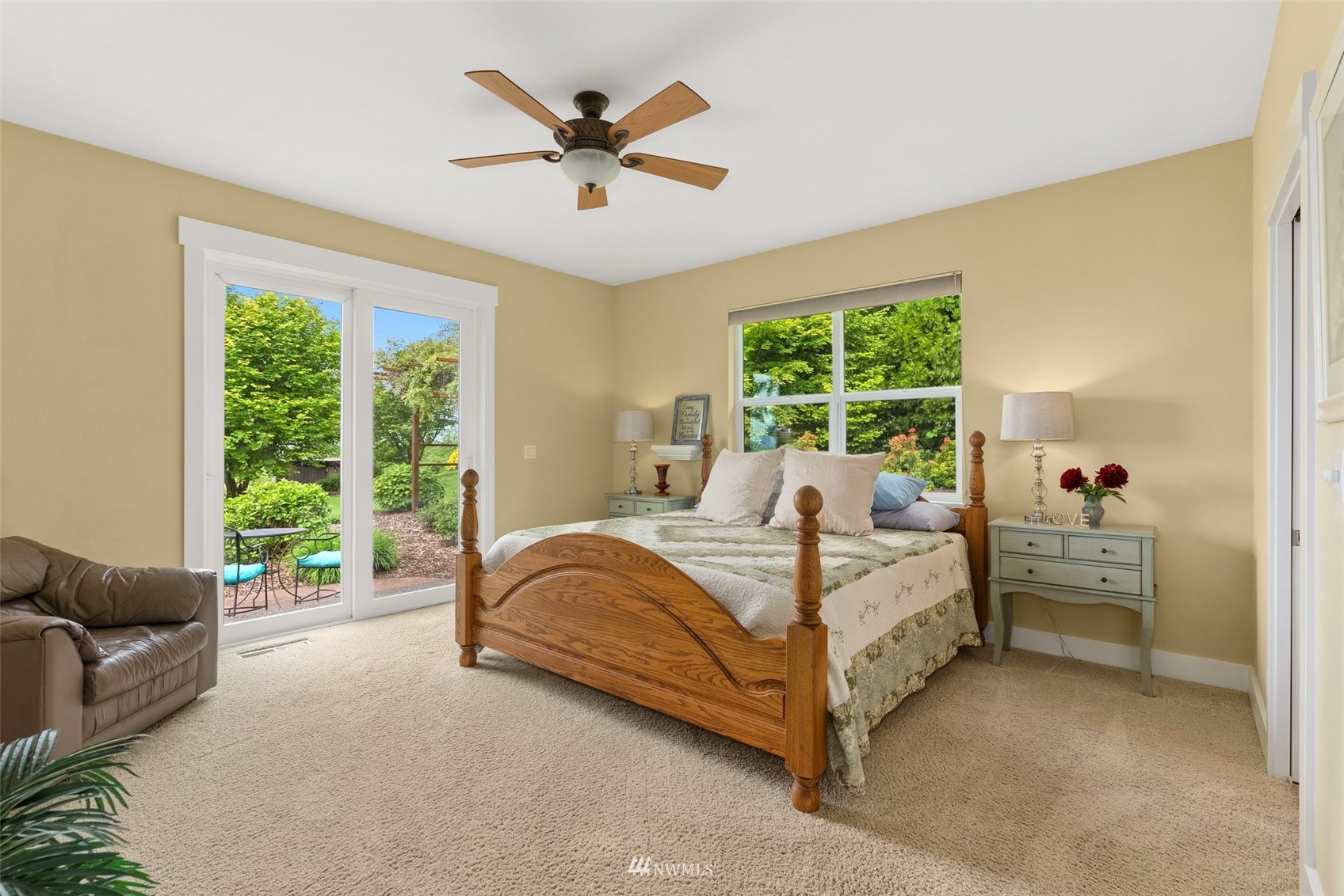 10434 Tilley Road Southwest Olympia, WA 98501 - Photo 19 of 40 a bed sitting in a spacious bedroom next to a window