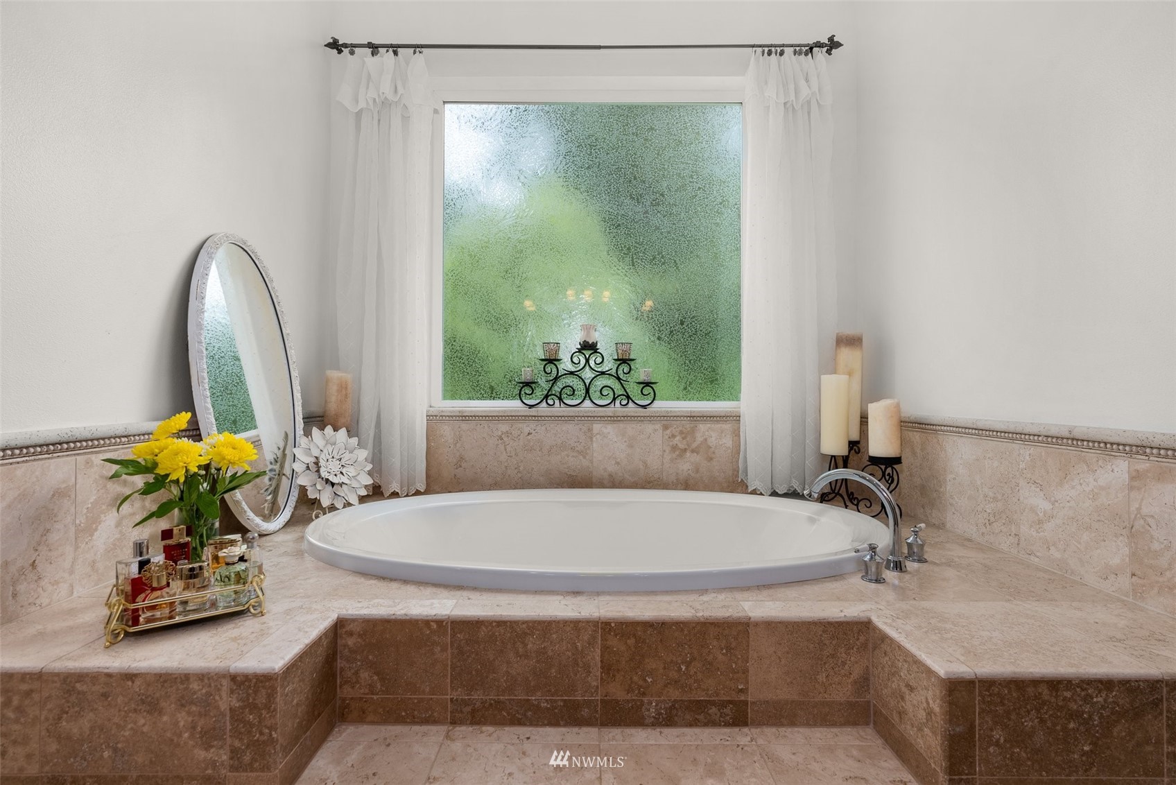 10434 Tilley Road Southwest Olympia, WA 98501 - Photo 22 of 40 a bathroom with a tub and a large window