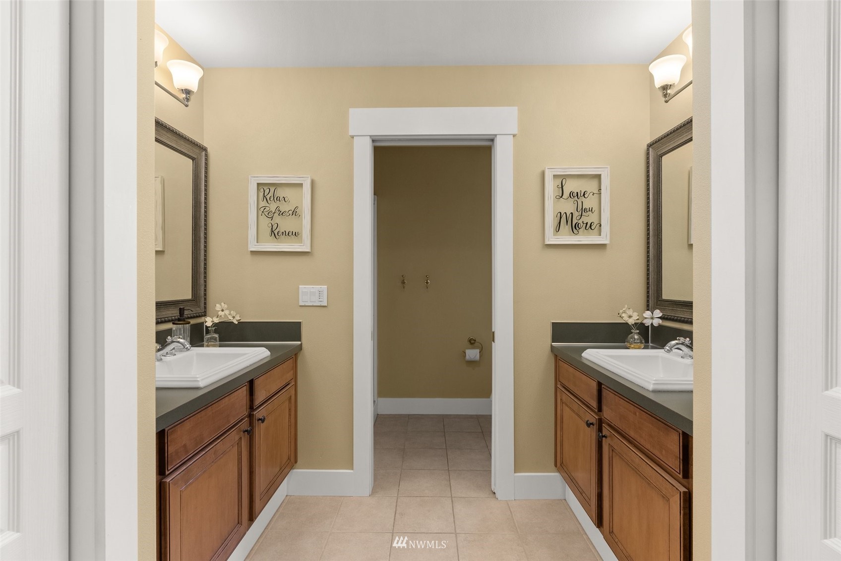 10434 Tilley Road Southwest Olympia, WA 98501 - Photo 25 of 40 a bathroom with a sink and a mirror