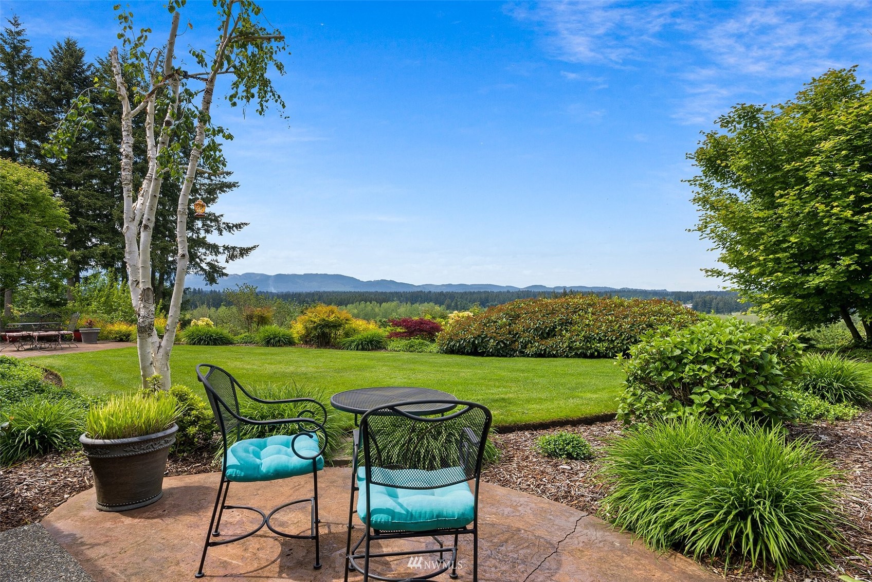 10434 Tilley Road Southwest Olympia, WA 98501 - Photo 39 of 40 a view of a table and chairs in the garden