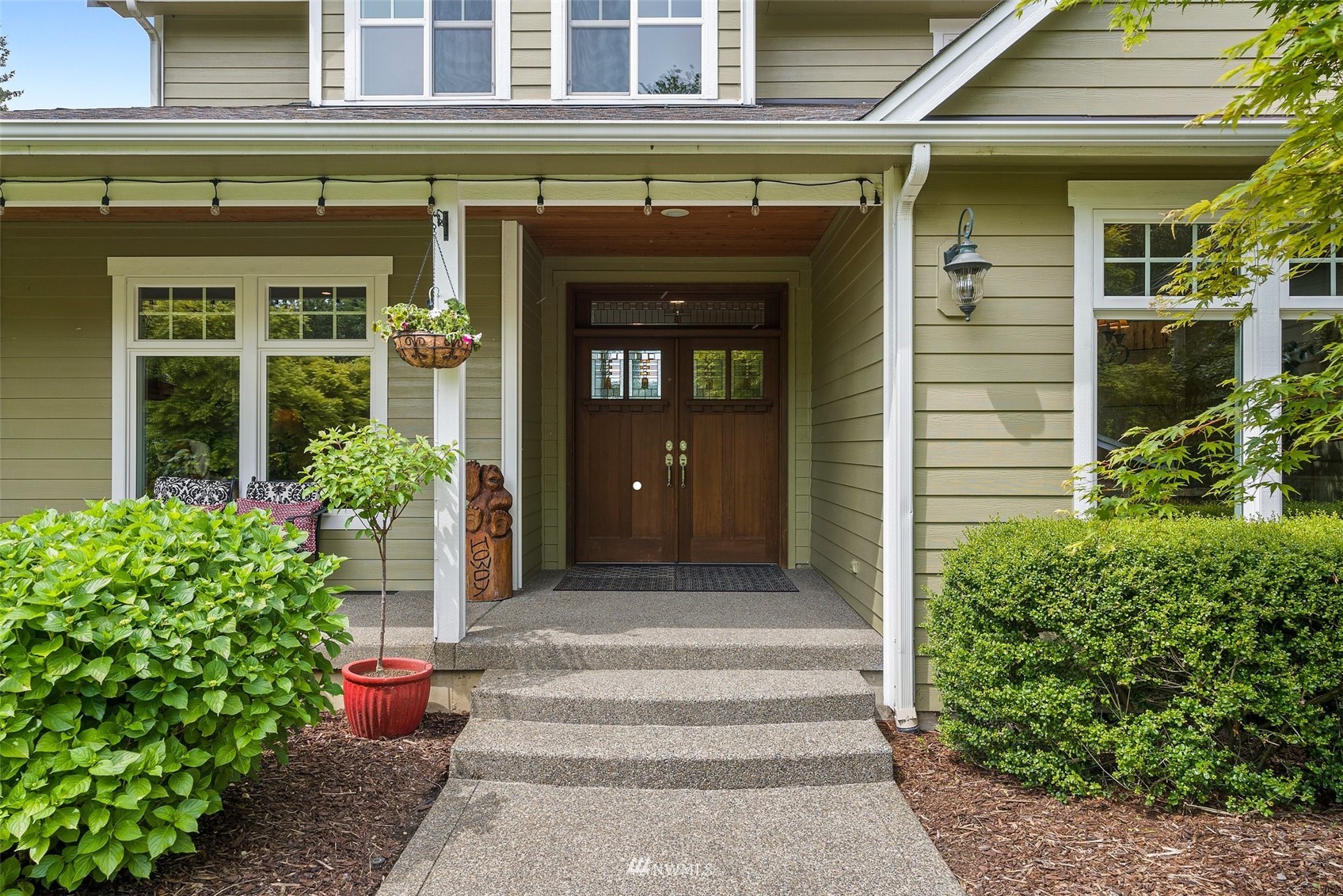 10434 Tilley Road Southwest Olympia, WA 98501 - Photo 5 of 40 a front view of a house with plants