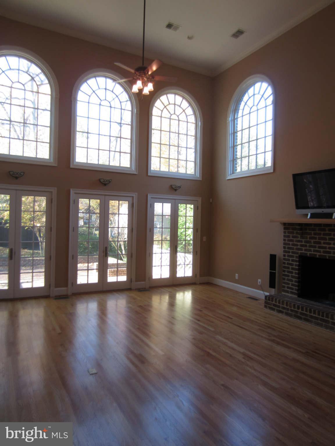 1910 Russell Road Alexandria, VA 22301 - Photo 11 of 25 a view of an empty room with wooden floor and a window