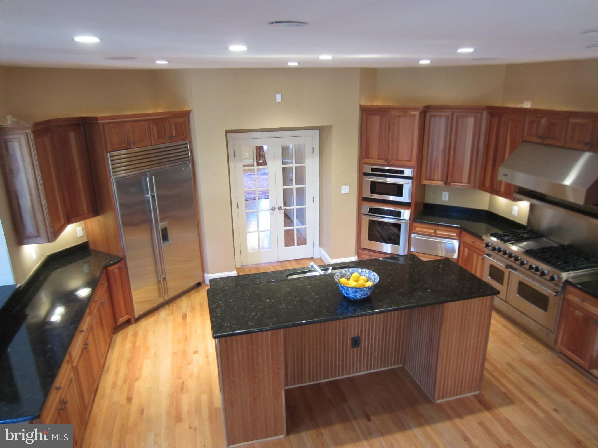 1910 Russell Road Alexandria, VA 22301 - Photo 13 of 25 a kitchen with stainless steel appliances granite countertop a stove a sink and a refrigerator