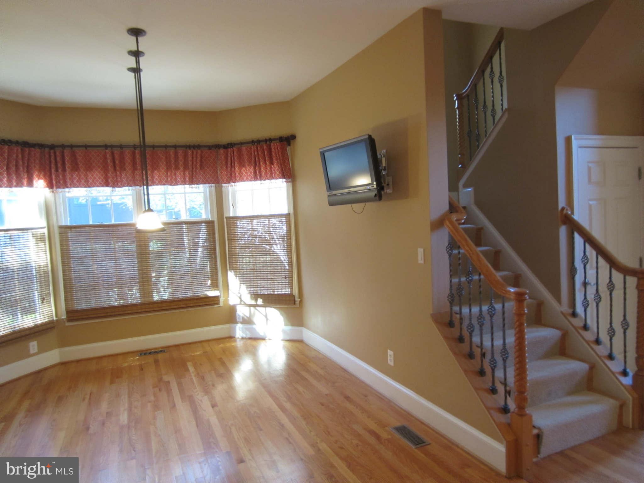 1910 Russell Road Alexandria, VA 22301 - Photo 16 of 25 a view of empty room with wooden floor and fan