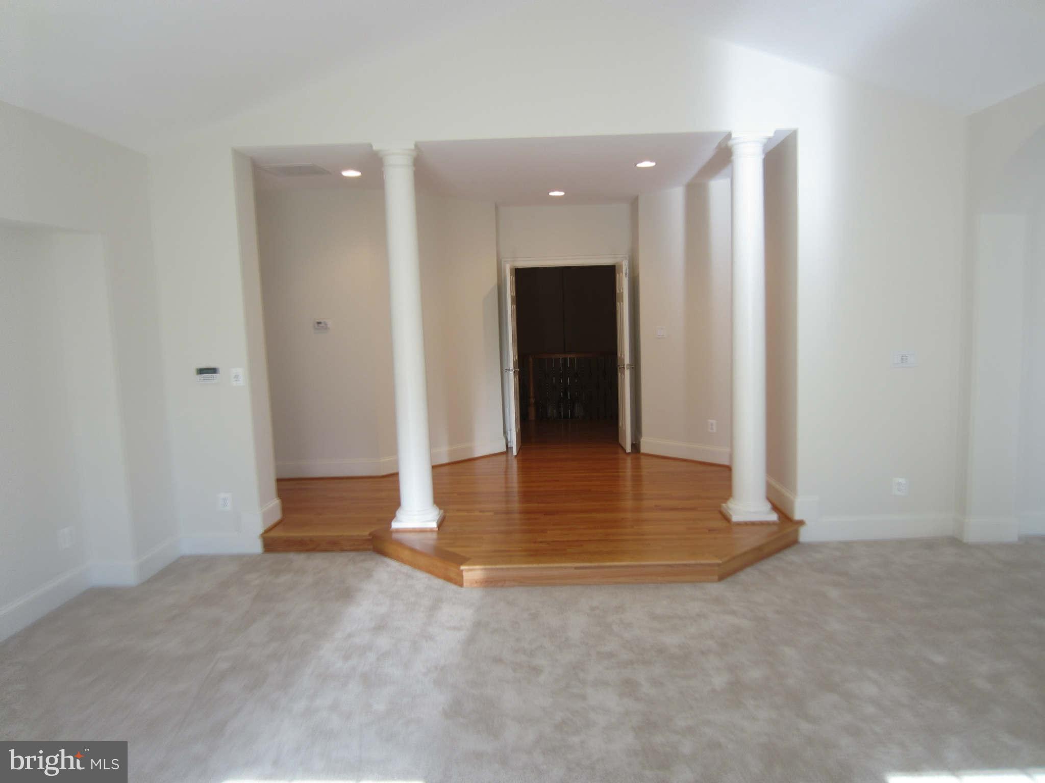 1910 Russell Road Alexandria, VA 22301 - Photo 19 of 25 a view of a hallway with wooden floor and a cabinet