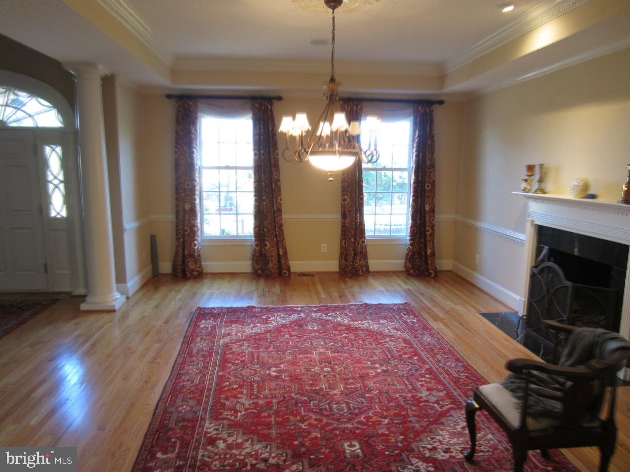 1910 Russell Road Alexandria, VA 22301 - Photo 8 of 25 a living room with furniture and a fireplace