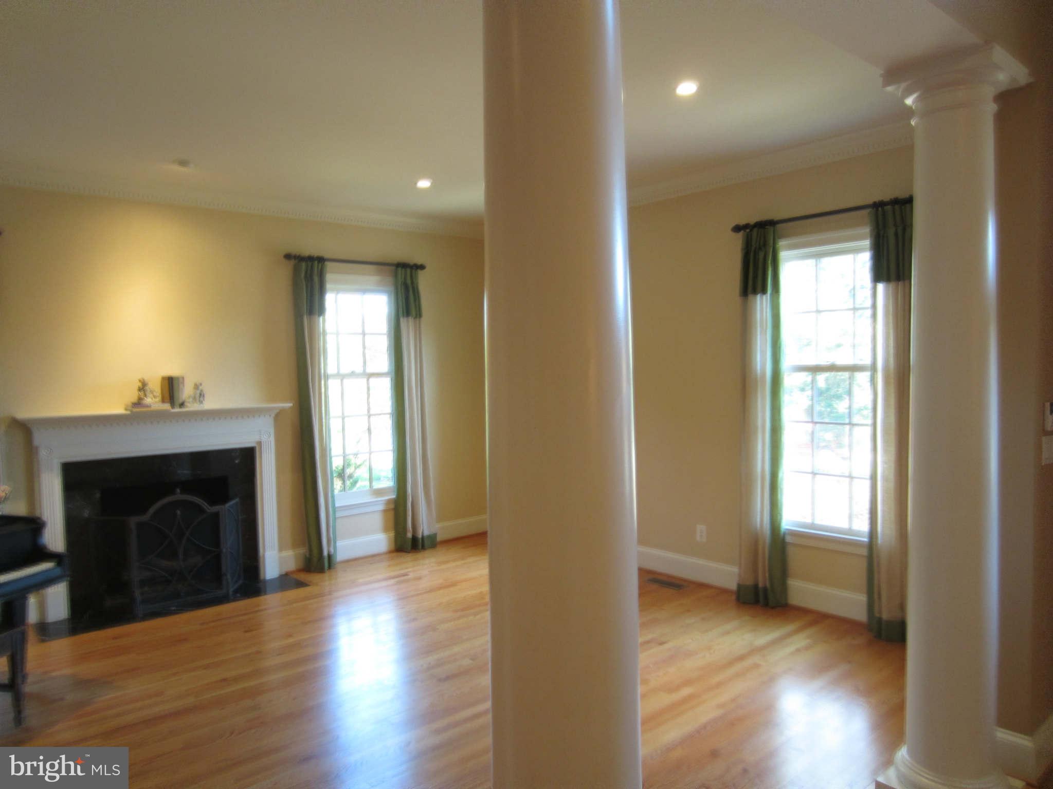 1910 Russell Road Alexandria, VA 22301 - Photo 9 of 25 a view of an empty room with wooden floor and a window