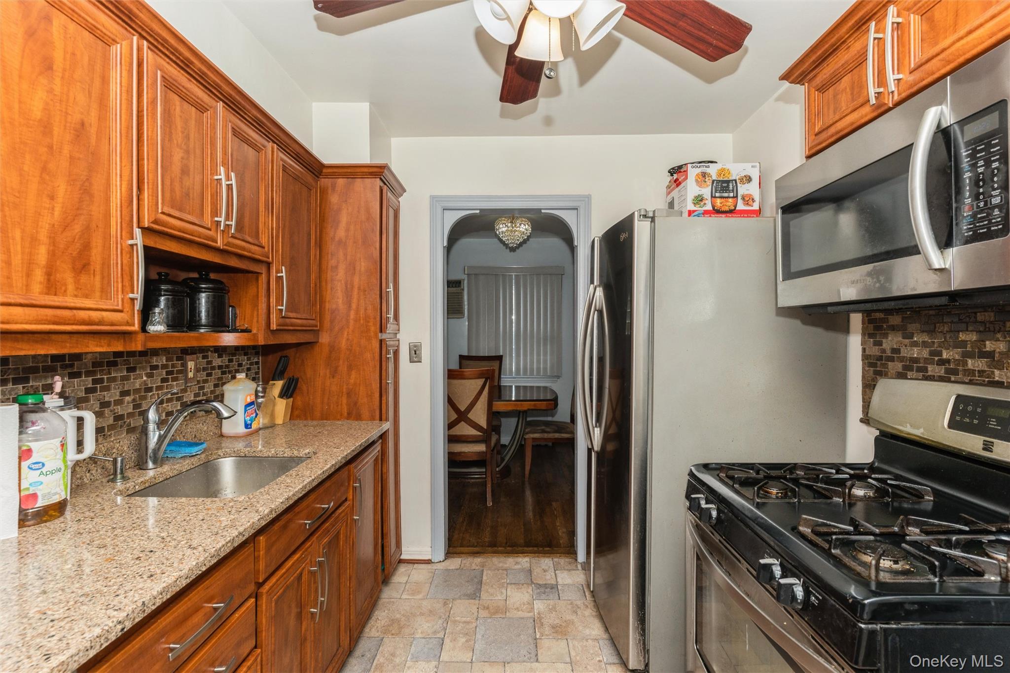6 Jasper Street Valley Stream, NY 11580 - Photo 7 of 19 a kitchen with stainless steel appliances granite countertop a stove and a sink