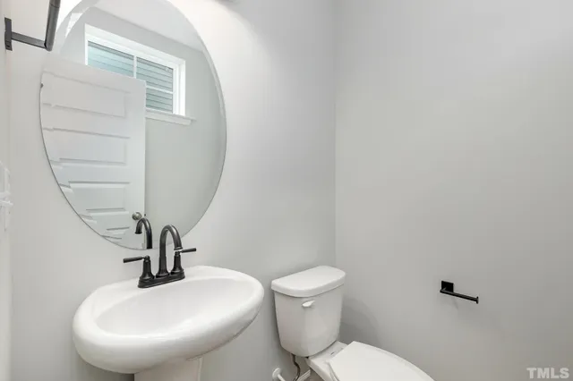 a bathroom with a toilet and a sink