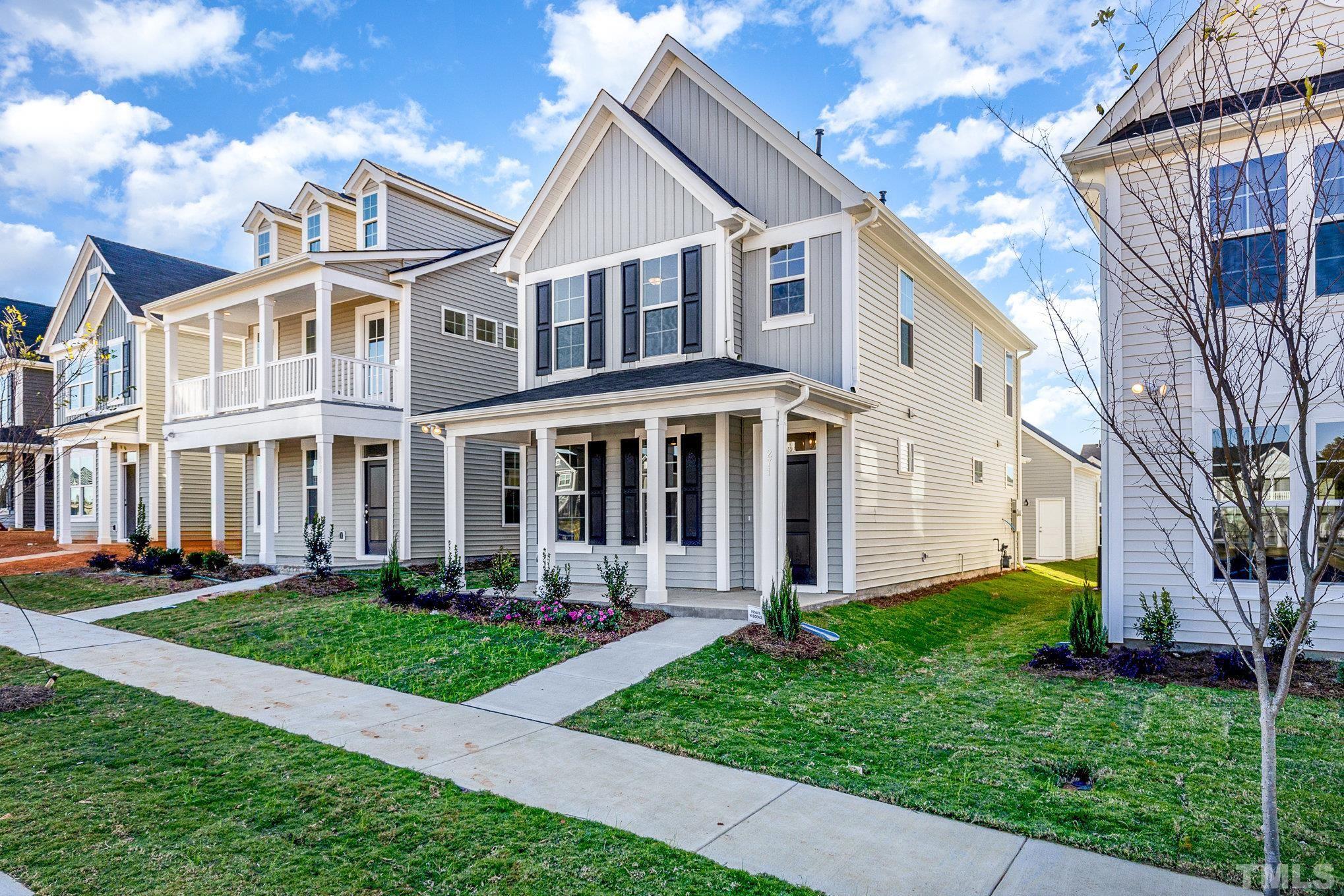 271 Pear Blossom Parkway Clayton, NC 27520 - Photo 2 of 25 a front view of a house with a yard