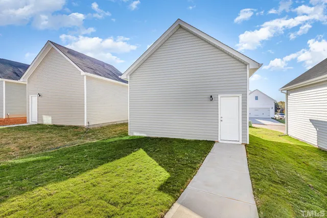 a view of a backyard with potted plants