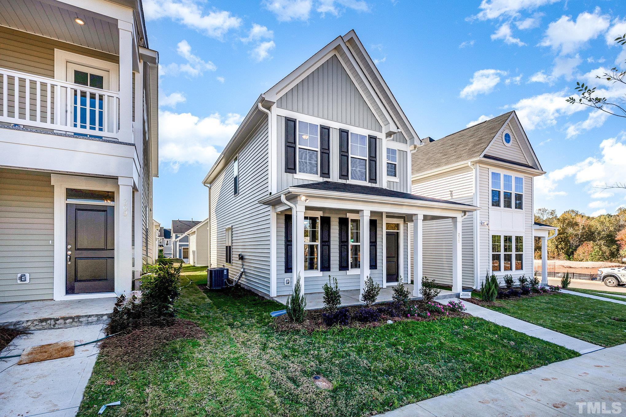 271 Pear Blossom Parkway Clayton, NC 27520 - Photo 3 of 25 front view of a house with a yard