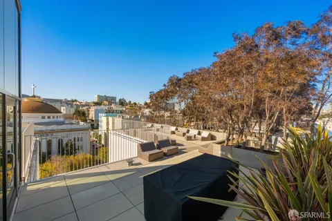 a view of a balcony with city view