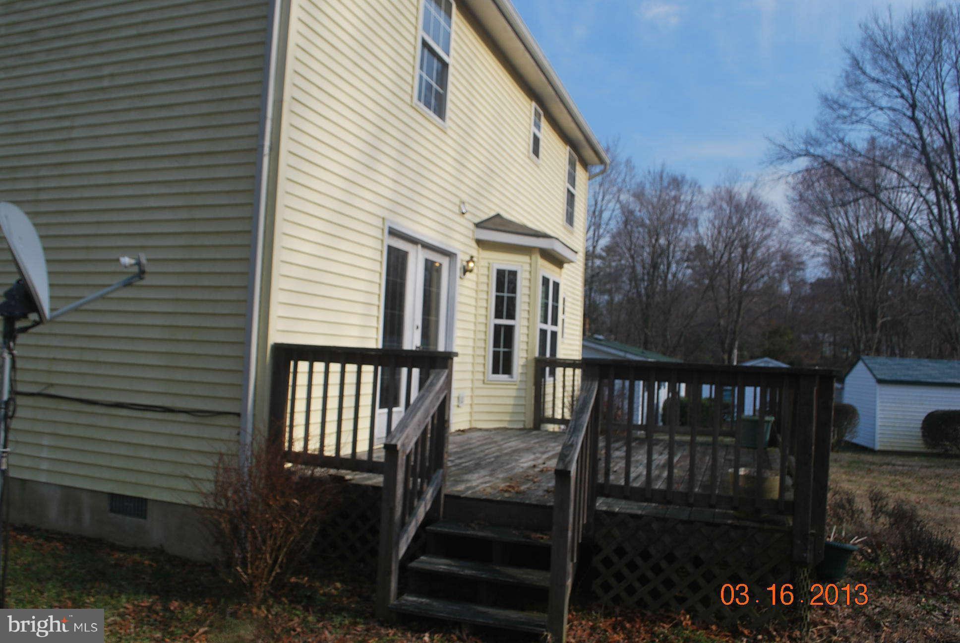 20161 Piney Point Road Callaway, MD 20620 - Photo 11 of 17 a view of a house with backyard and deck