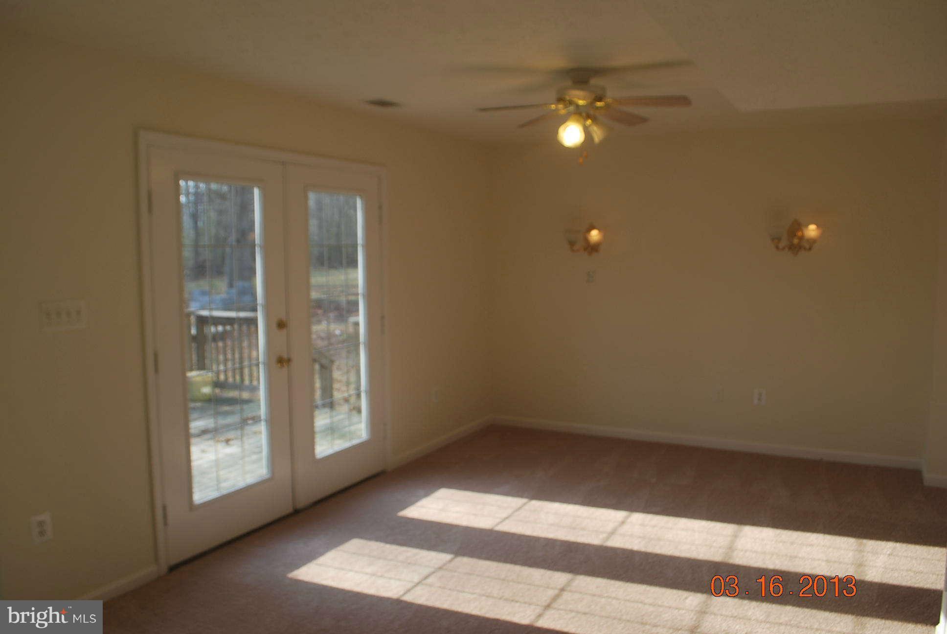 20161 Piney Point Road Callaway, MD 20620 - Photo 6 of 17 a view of an empty room with a window