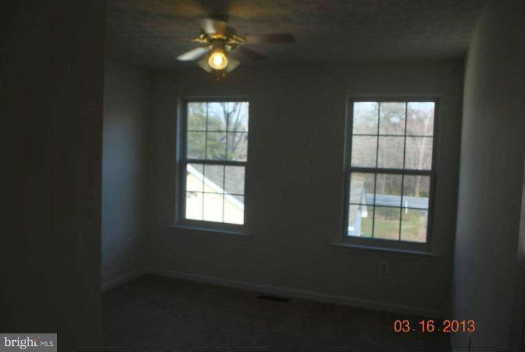 20161 Piney Point Road Callaway, MD 20620 - Photo 9 of 17 a view of a livingroom with an empty space and a window