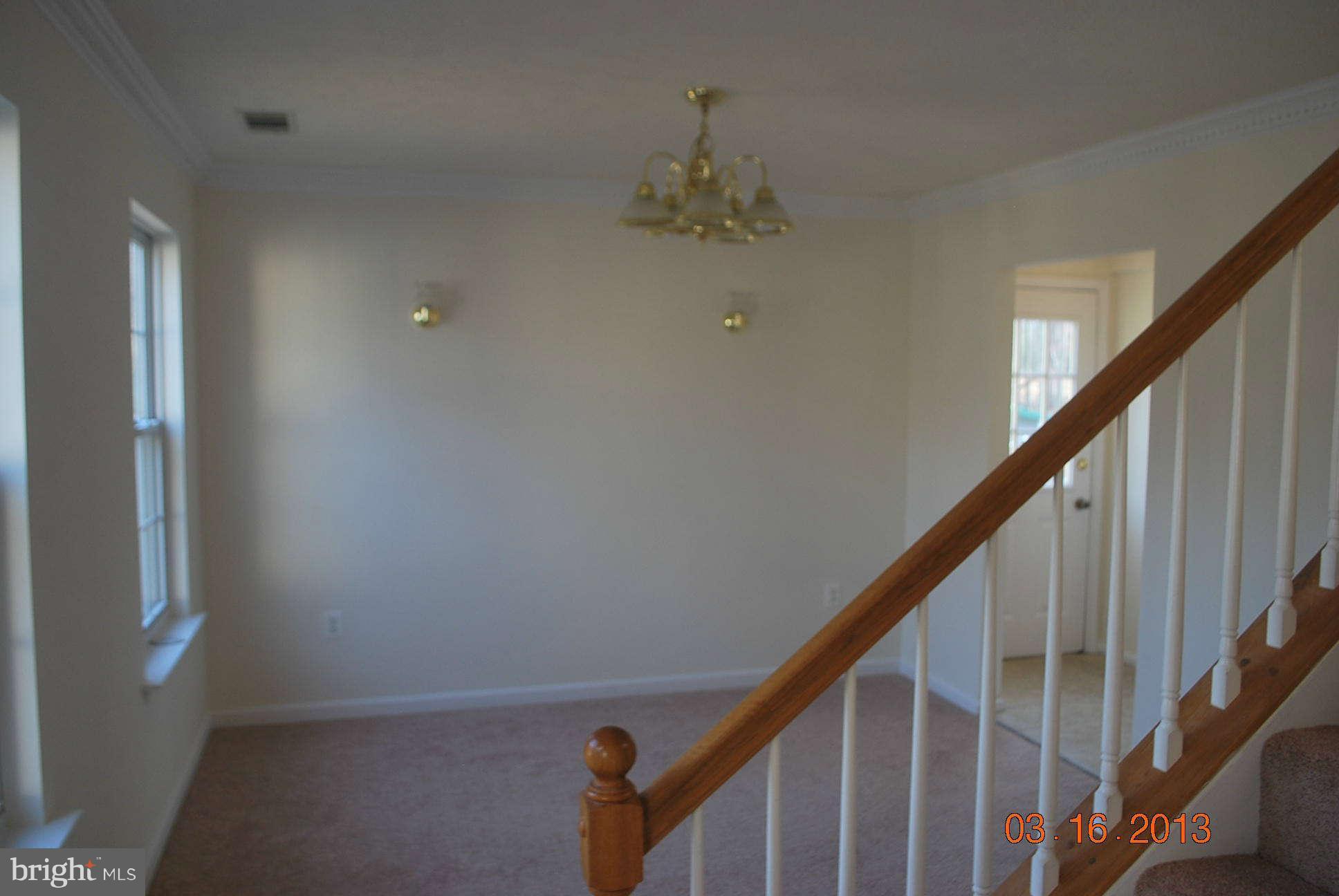 20161 Piney Point Road Callaway, MD 20620 - Photo 10 of 17 a view of staircase with railing and white walls