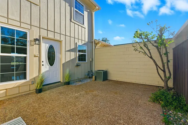 a view of a house with a potted plant and a window